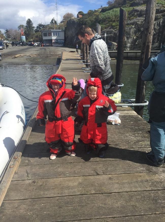 children passengers bundled up on private boat tour